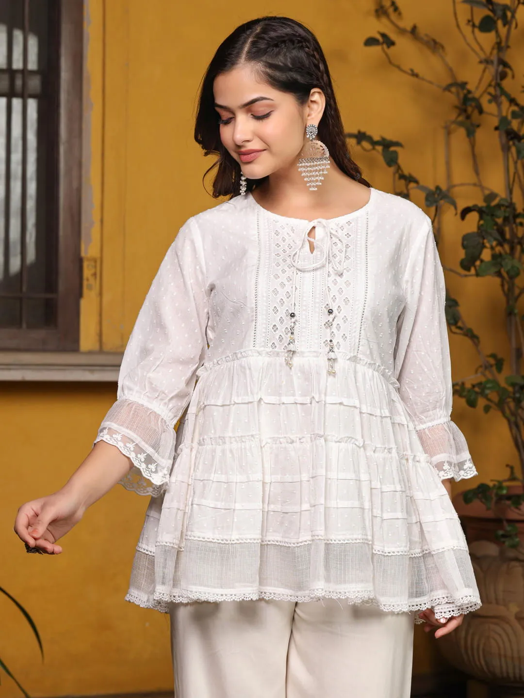 Jashvi  White Solid Peplum Lacy Keyhole Neckline Tunic With Lining