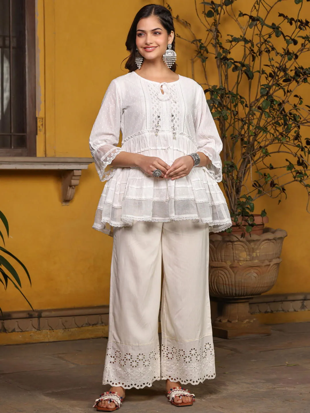 Jashvi  White Solid Peplum Lacy Keyhole Neckline Tunic With Lining