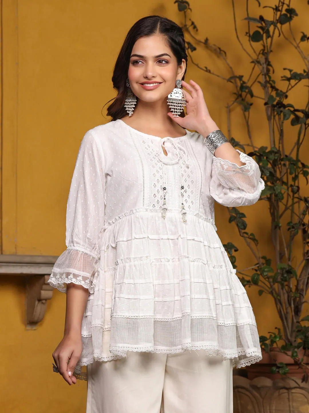 Jashvi  White Solid Peplum Lacy Keyhole Neckline Tunic With Lining