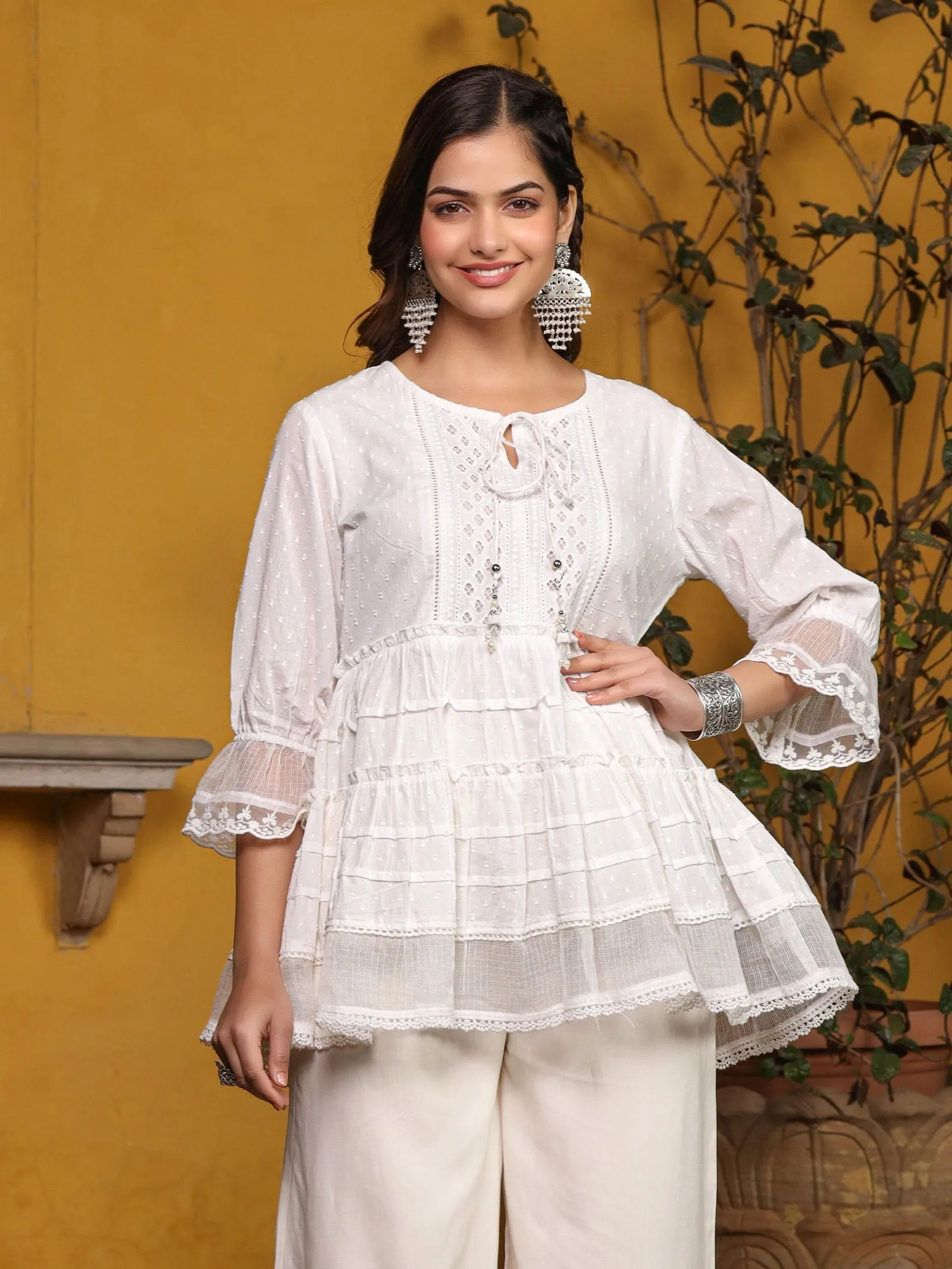 Jashvi  White Solid Peplum Lacy Keyhole Neckline Tunic With Lining